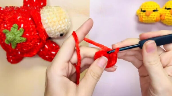 Crocheting red stitches with black hook