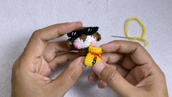 Amigurumi monkey with sunglasses and yellow banana bag