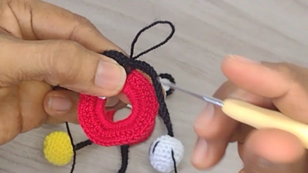 Attaching black ear to head piece
