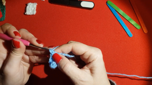 Chain stitches worked in light blue yarn