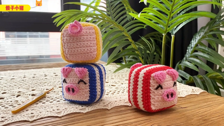 Chubby Crochet Dice Pig Amigurumi Pattern on wooden table
