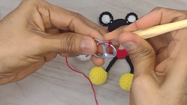 Crocheting red shorts with keychain ring