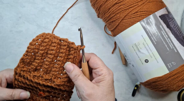Crocheting textured stitches on autumn sweater scarf