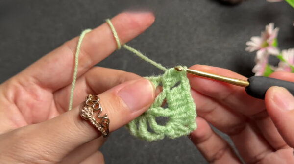 Double crochet stitches building coaster motif