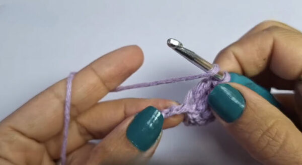Double crochet stitches into chain row