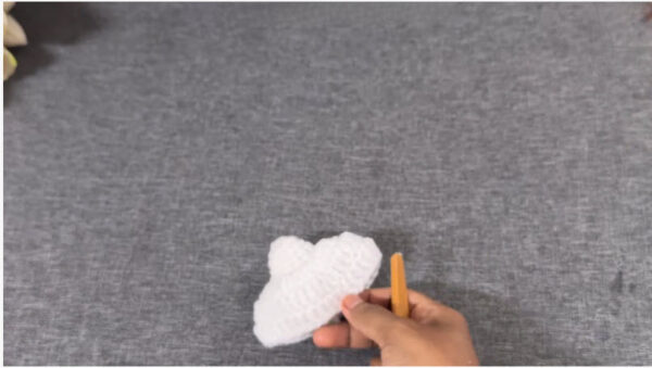 Finished cloud shaped crochet piece