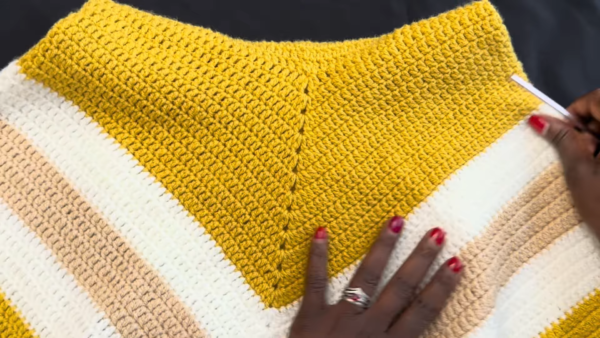 Finished mustard poncho neckline close-up
