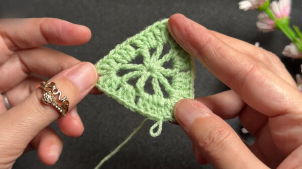 Finished star-motif crochet pattern in green