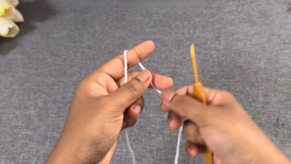 Making slip knot with white yarn