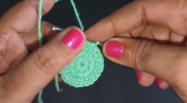 Mint green completed crochet circle hath mein.