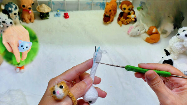 Round 42 increases on the white amigurumi limb.