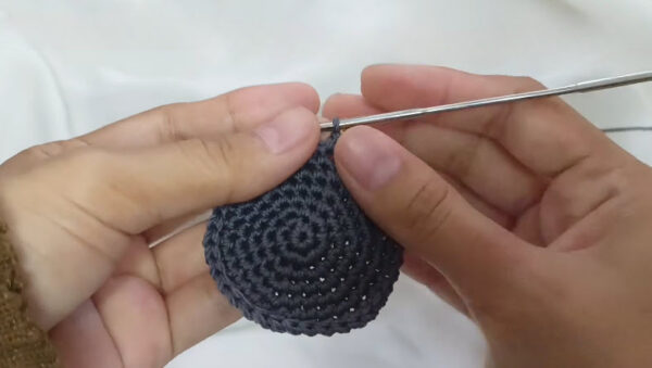 Rounds 8-9 crocheted flat in gray yarn for the koala ear piece.
