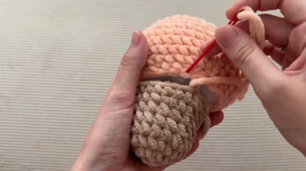 Sewing ice cream scoop onto crochet cone