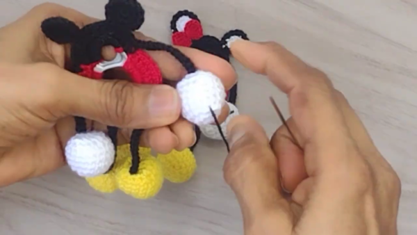 Sewing white glove hand pieces together