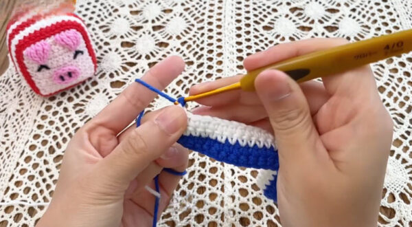 Starting row five of crochet dice pig