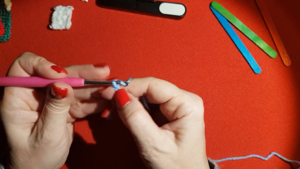 Starting slip knot for blue Christmas house ornament