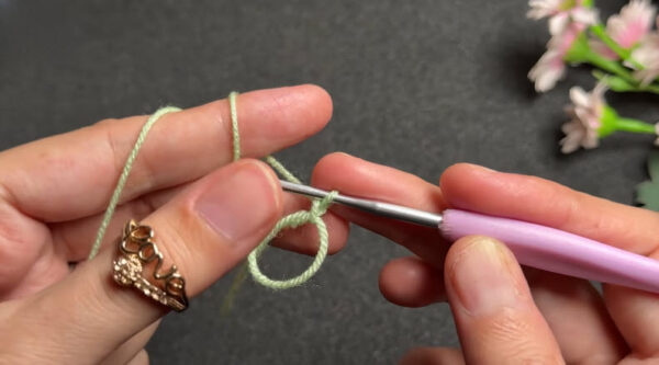Starting slip knot for green crochet coaster