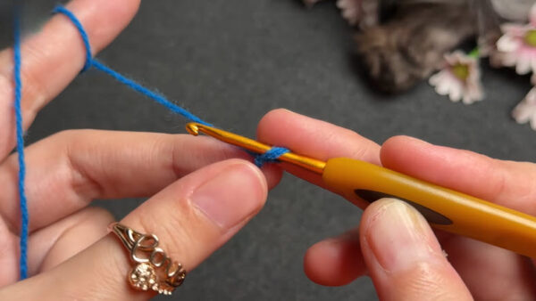 Starting slip knot on blue crochet coaster yarn