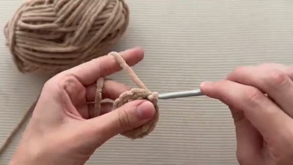 Starting the crochet cone in beige yarn