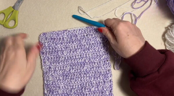 Textured crochet panel ready for toilet paper roll cover