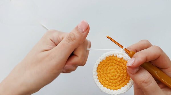 White border added around yellow crochet circle