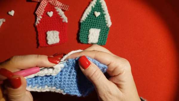 White edging added to blue crochet house