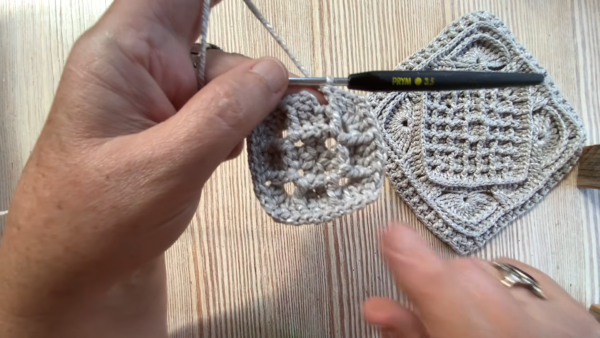 Working first rounds of grey granny square