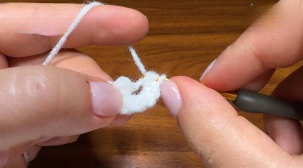 Working ten half double crochet stitches