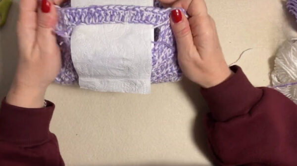 Wrapping crochet panel around toilet paper roll