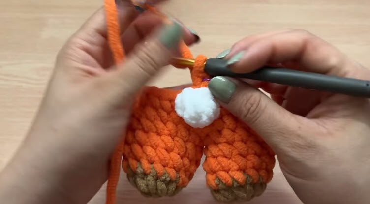 Crochet single crochet rounds and attach the white tail.