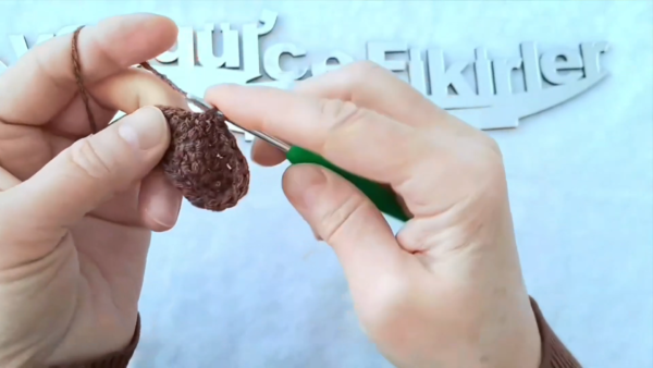 Crocheting a small brown base for the sunflower center