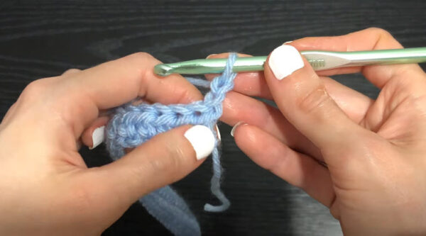 Starting the crochet Argentina sweater with light blue chain stitches
