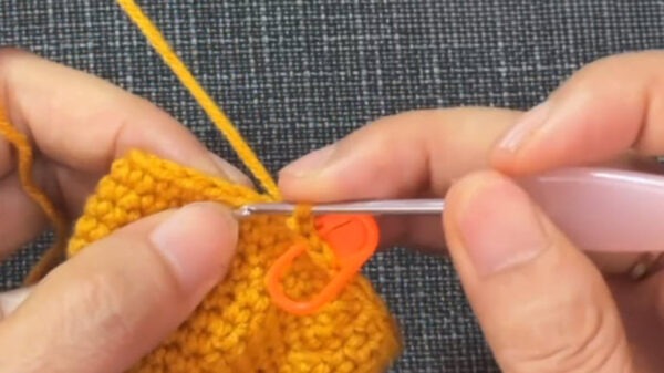 Decrease round shaping the sides of the yellow body