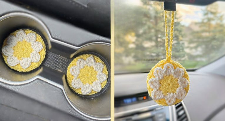 Yellow and white crochet daisy coasters sitting in a car cup holder, with a matching daisy hanging from the rear view mirror