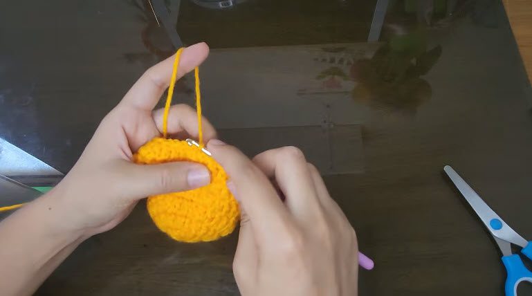 Orange circle with sides beginning to curve upward