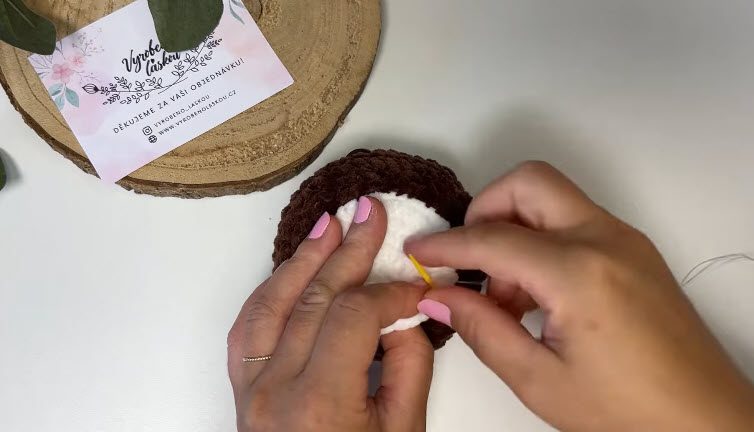 Sew the white base onto the brown body.