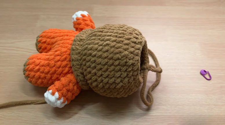 Stuff the brown head and close the opening with a yarn tie.