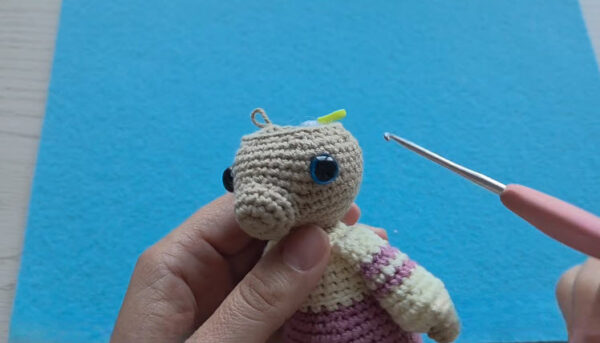 Tan head with blue safety eyes placed on the body.