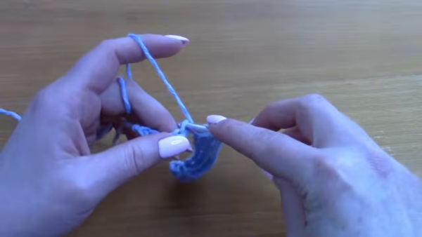 Working half double crochet stitches into the base chain